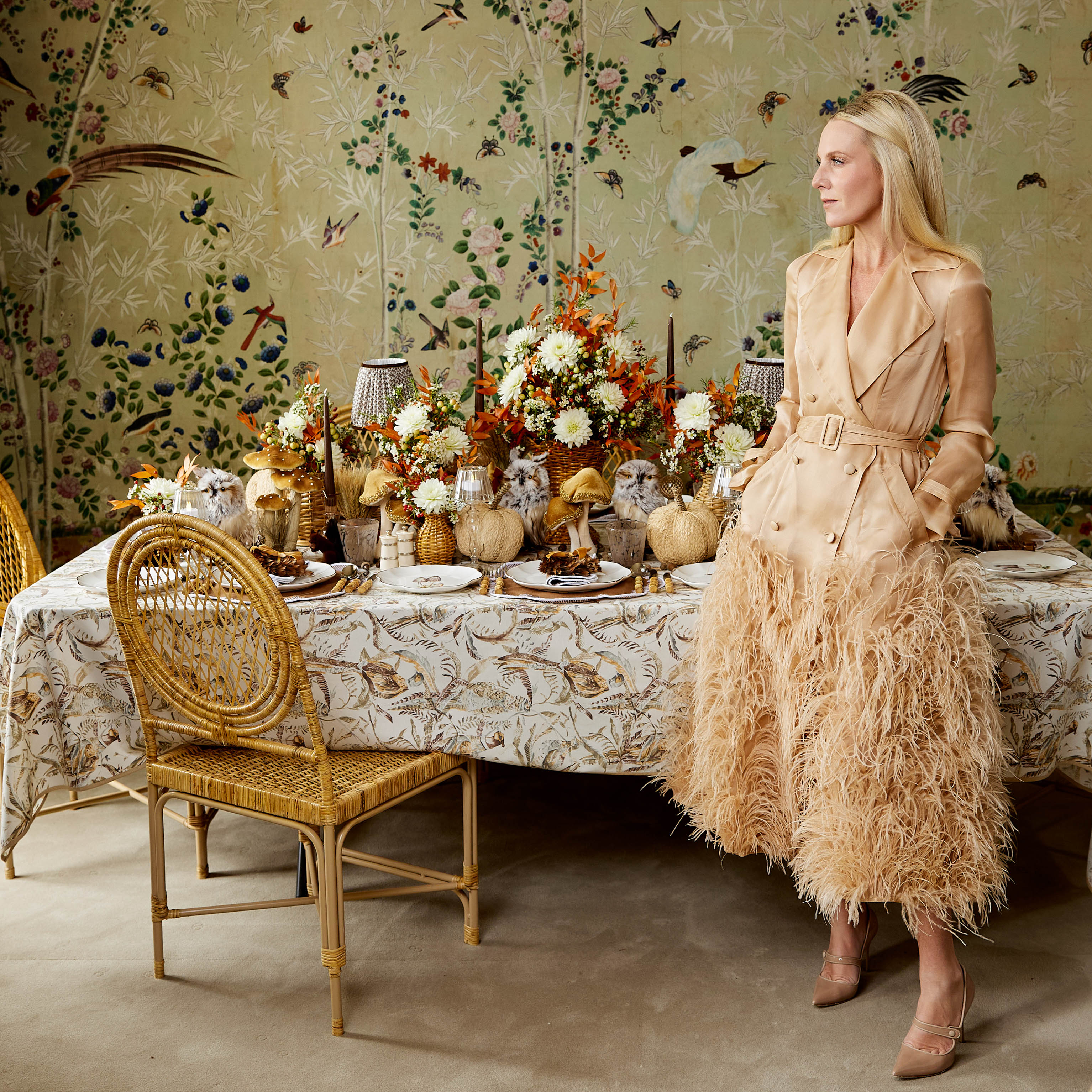 Decorative tablecloth adorned with shaded pheasant illustrations.