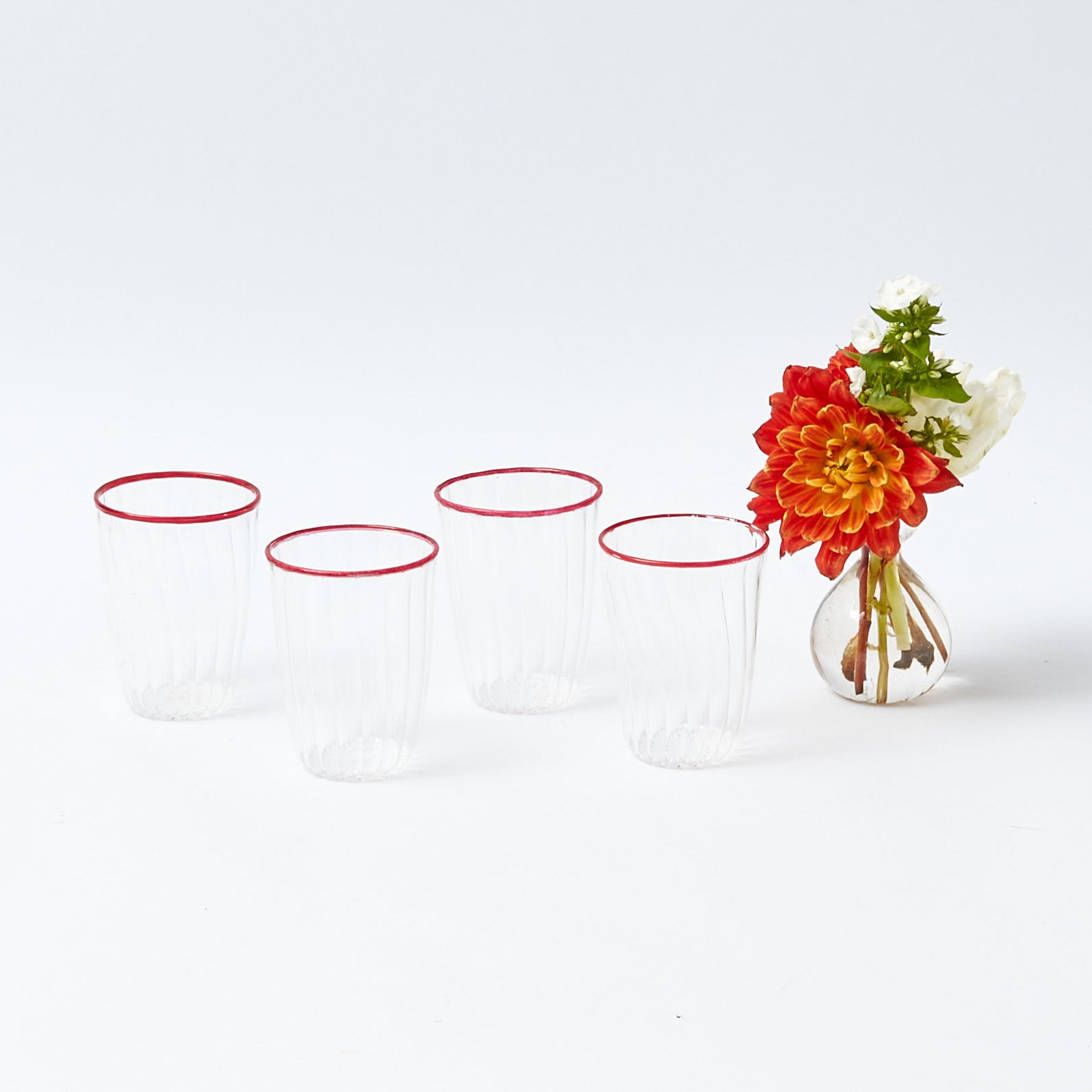 https://www.mrsalice.com/cdn/shop/files/Red-rim-water-glasses-Tish-edit.jpg?v=1698407829