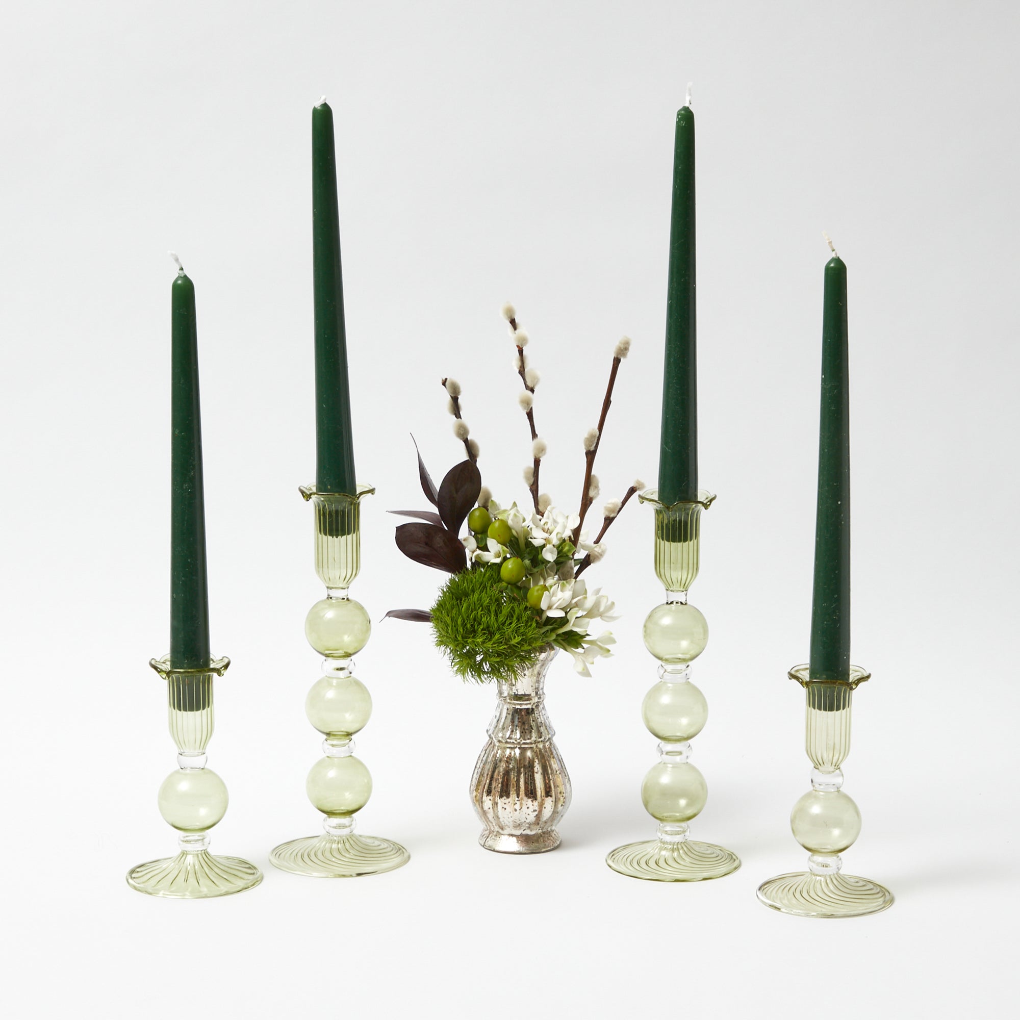 Turn your space into a woodland retreat with the Eden Green Candle Set in Forest Green, a set of 12 candles designed to offer the tranquil atmosphere of the forest.