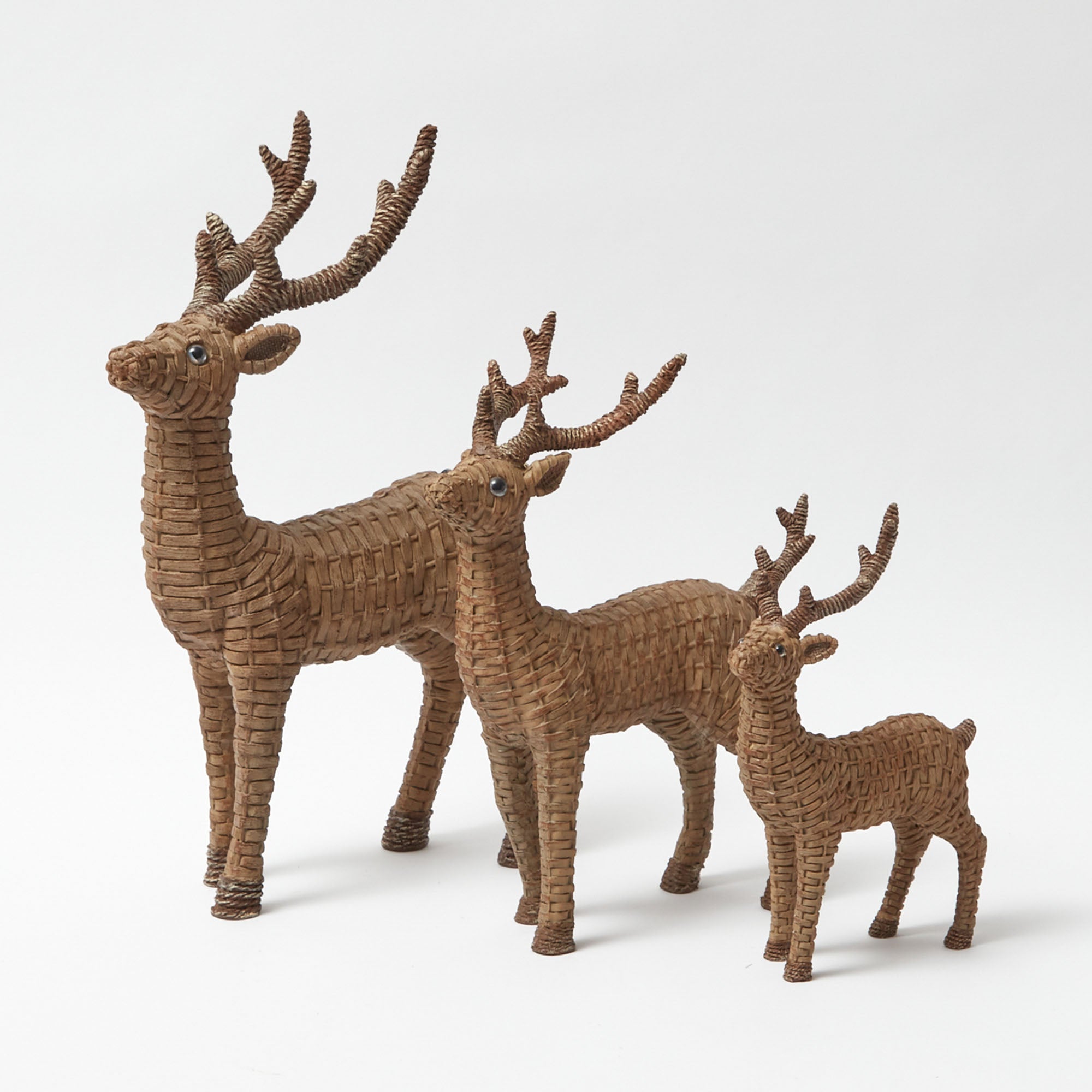 Add a touch of woodland enchantment with this Mini Rattan Reindeer pair.