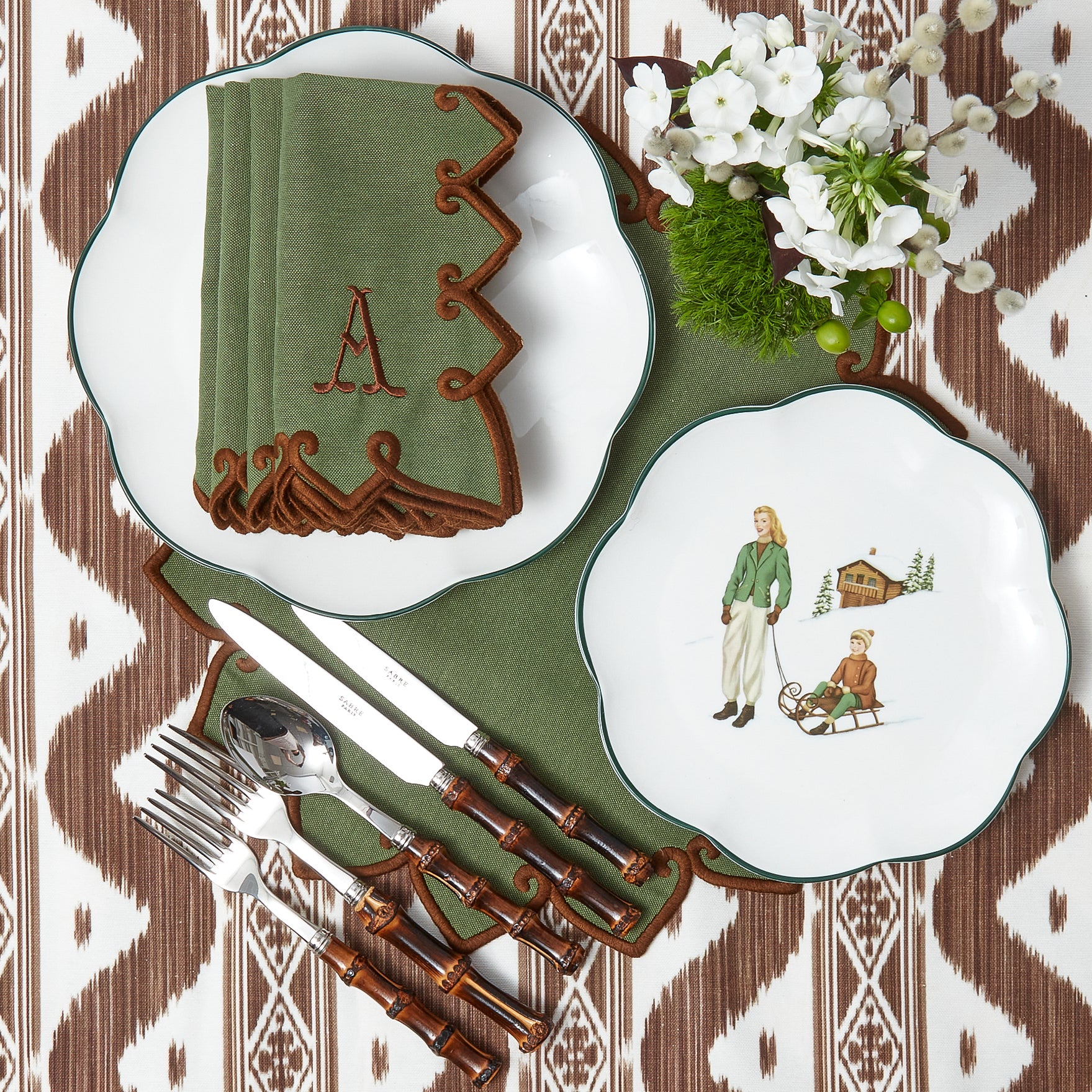 Elevate your Christmas decor with the whimsical and enchanting beauty of the Heidi & Hans Skier Starter Plates - a simple yet stylish statement of holiday sophistication.