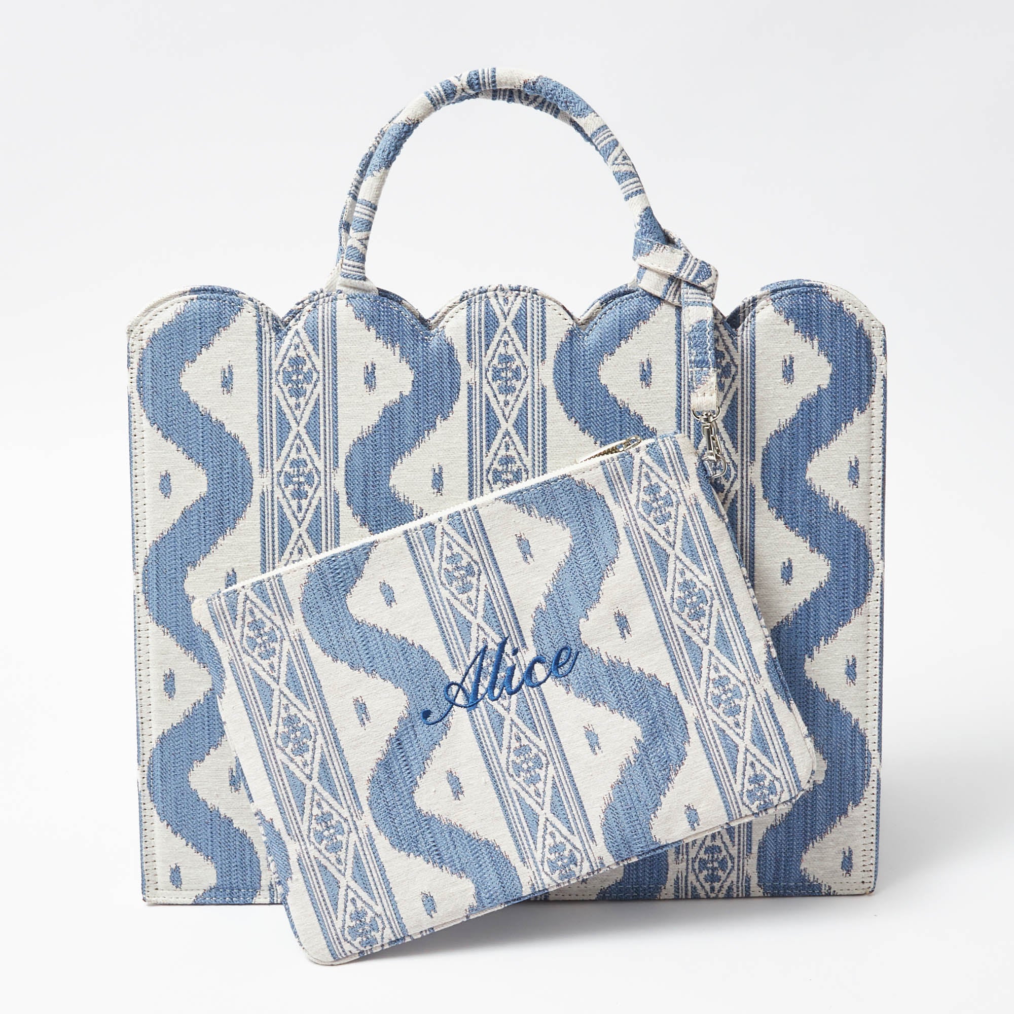 Perfect your outfit with "The Tote-ally Fabulous" Giftscape, which includes the Blue Ikat Pochette (Zip fastening) for a stylish touch.