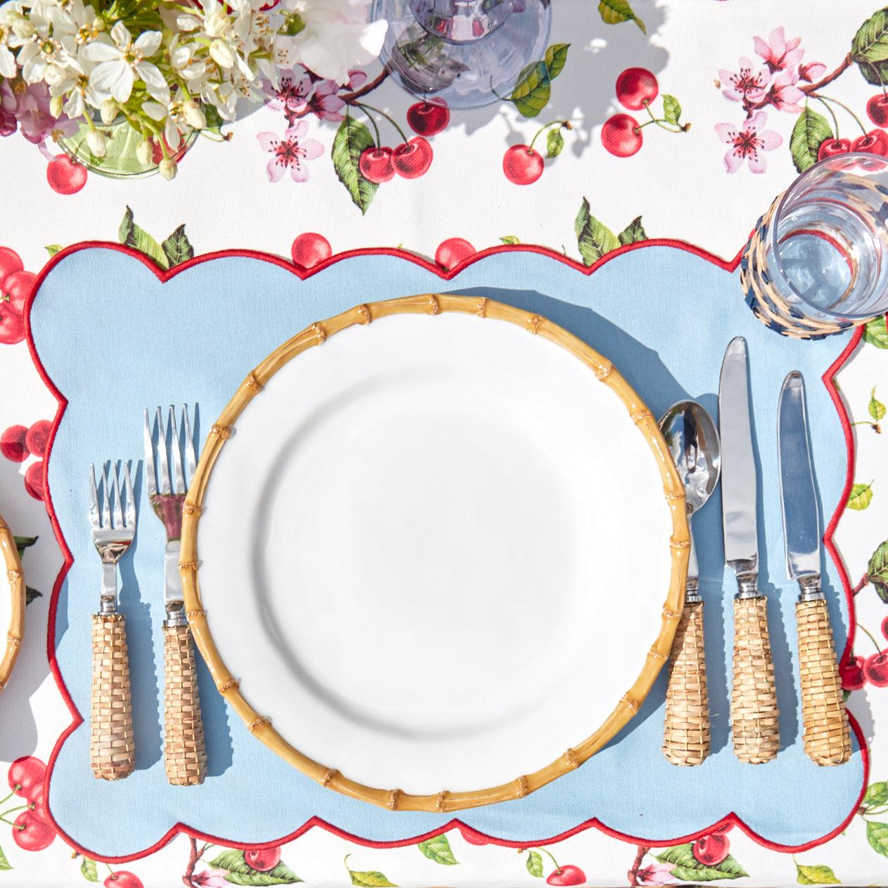 https://www.mrsalice.com/cdn/shop/files/blue-with-red-scallop-placemat-set-of-4-mrs-alice-8_b39fdb32-91f5-4055-926e-0ffe2caa6b42.jpg?v=1689325409