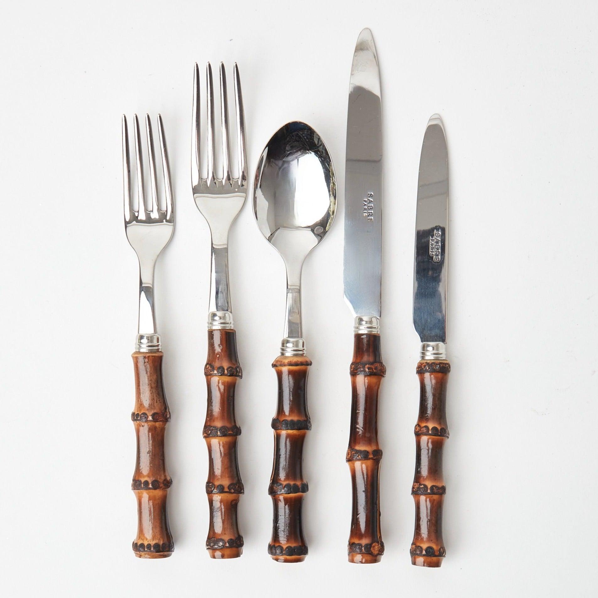 Elevate your dining experience with our 5-Piece Burnt Bamboo Cutlery Set - a touch of rustic elegance for your table.