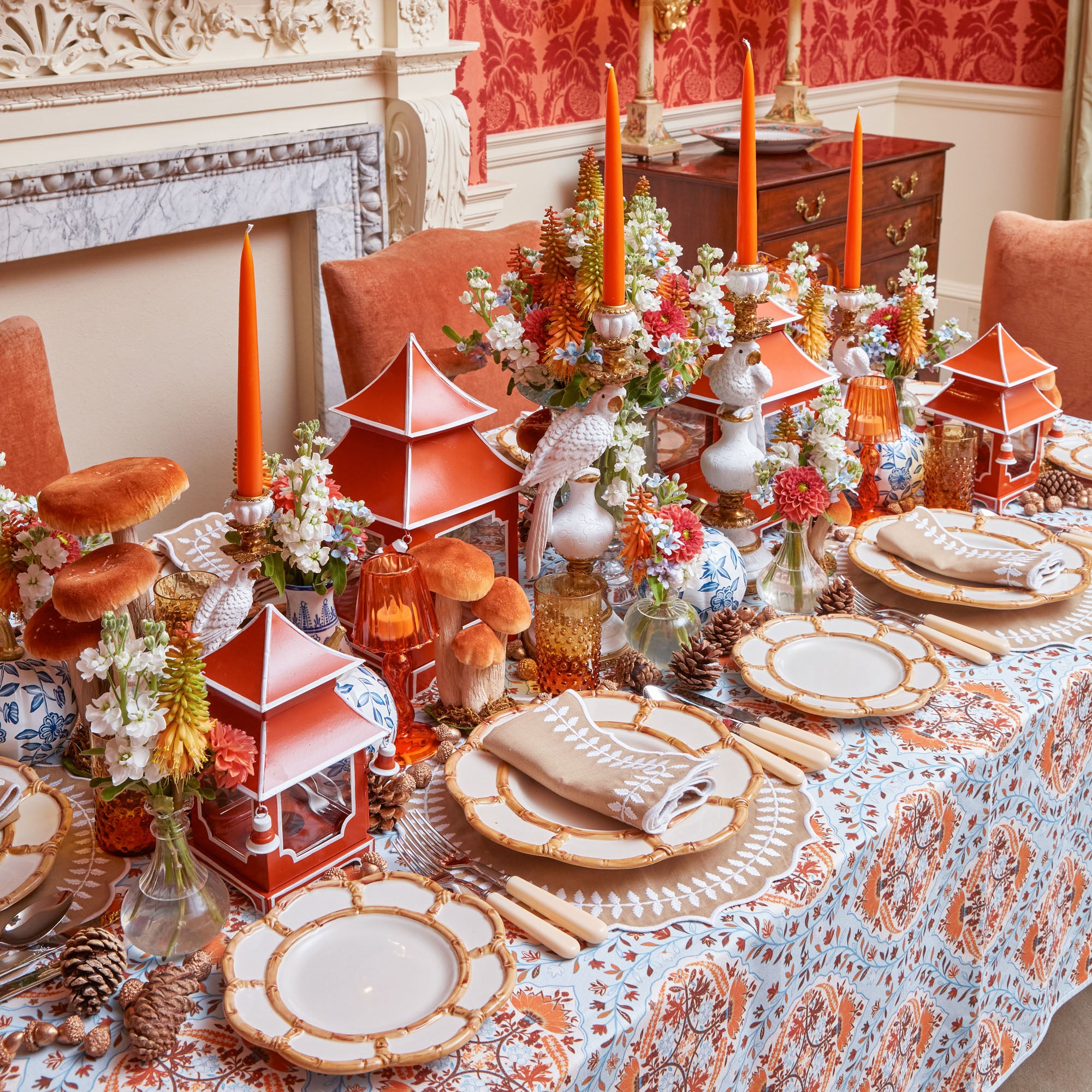 Burnt orange lantern crafted with a pagoda-inspired silhouette.