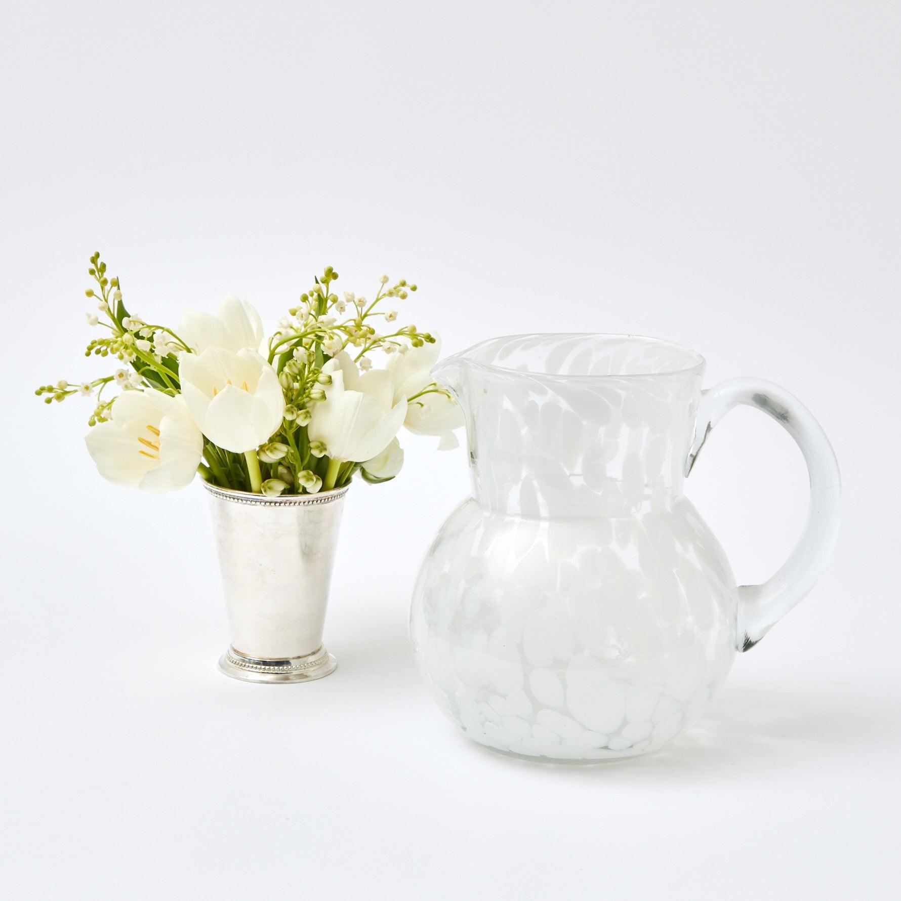 Elevate your Christmas gatherings with the festive beauty of our Dappled White Glasses & Jug Set - a symbol of holiday grace, offering both glasses and a jug for a complete table setting.