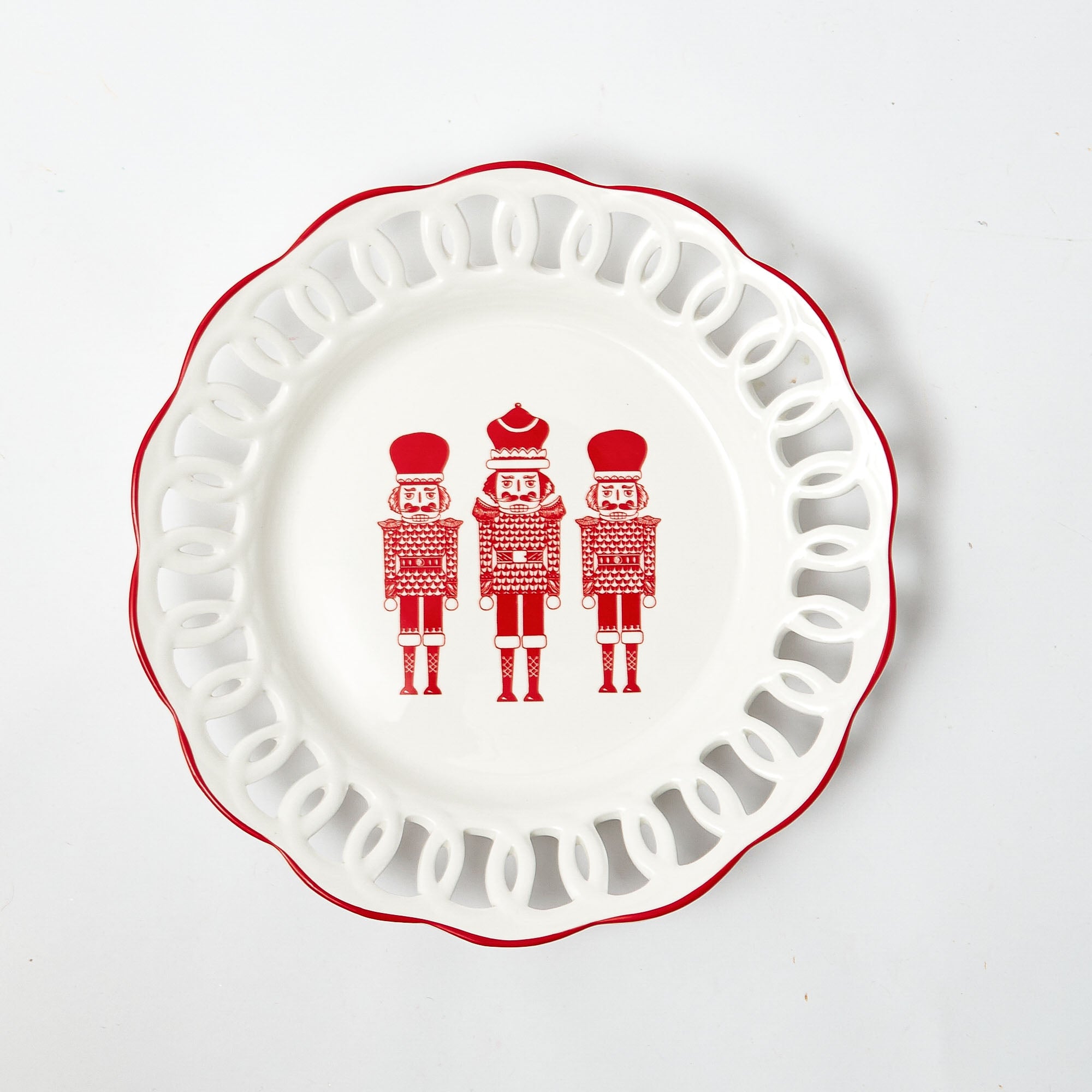 Delight in the captivating charm of the White Lace Nutcracker Dinner Plate, a stunning and elegant plate that adds a touch of unique beauty to your holiday feasts, adorned with graceful nutcrackers.