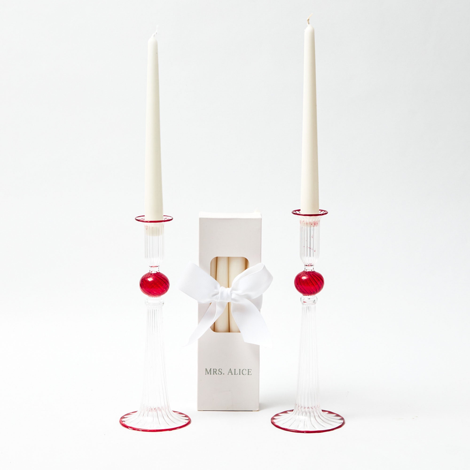 Create a warm and inviting ambiance with the Paulette Red Candle Holders (Pair), perfect for enhancing the beauty of your surroundings.