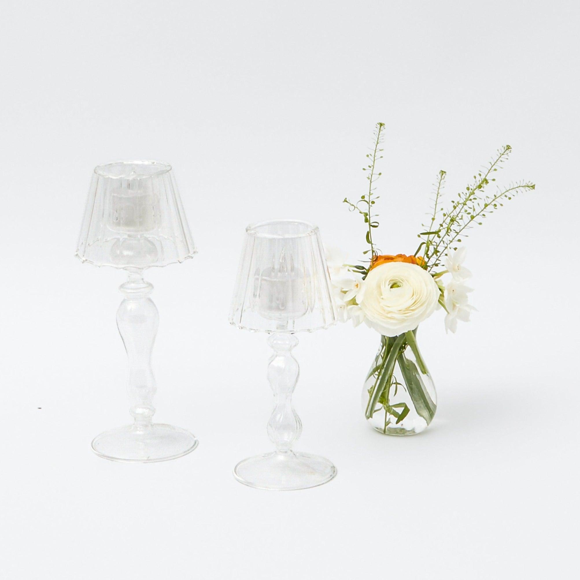 Elevate your interior decor with the warmth and charm of the Glass Lantern Tea Light Holder Set - a delightful addition that adds a dash of enchanting illumination to your home.