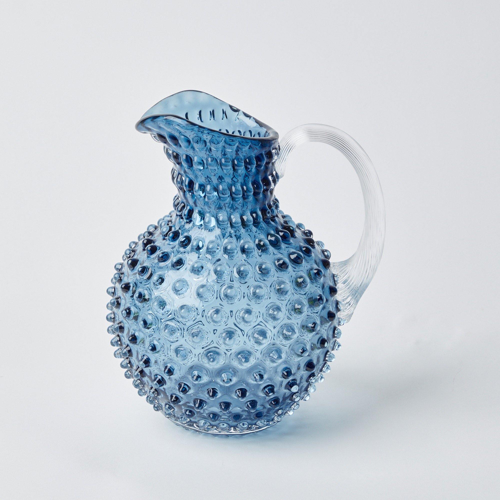 Enhance your gatherings with the classic charm of our Hobnail Navy Glasses & Jug Set, designed to bring a touch of elegance to your drinking experience.