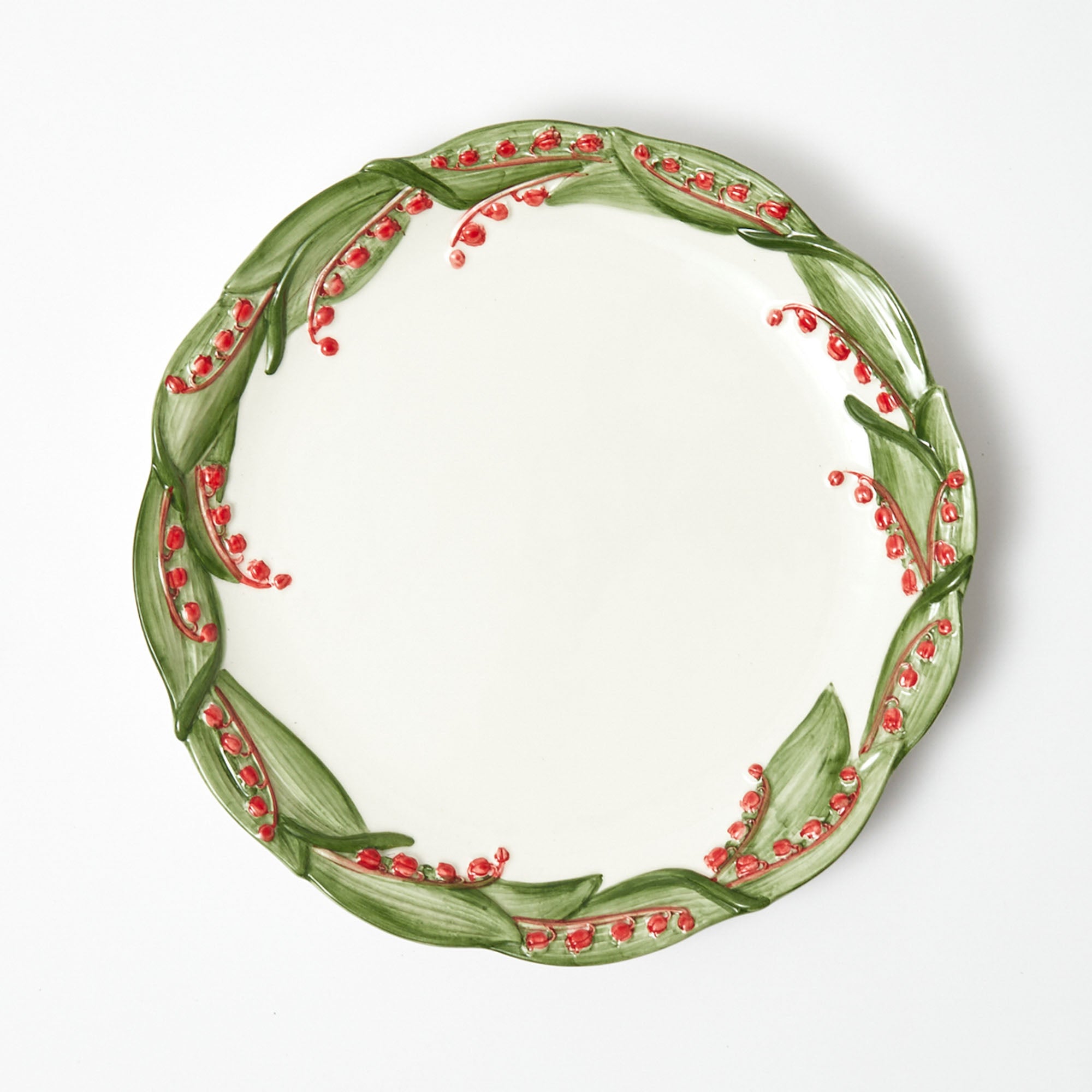 Elevate your holiday feasts with the Red Berry Dinner Plate, a stunning addition that captures the essence of the season with vibrant red berry motifs.