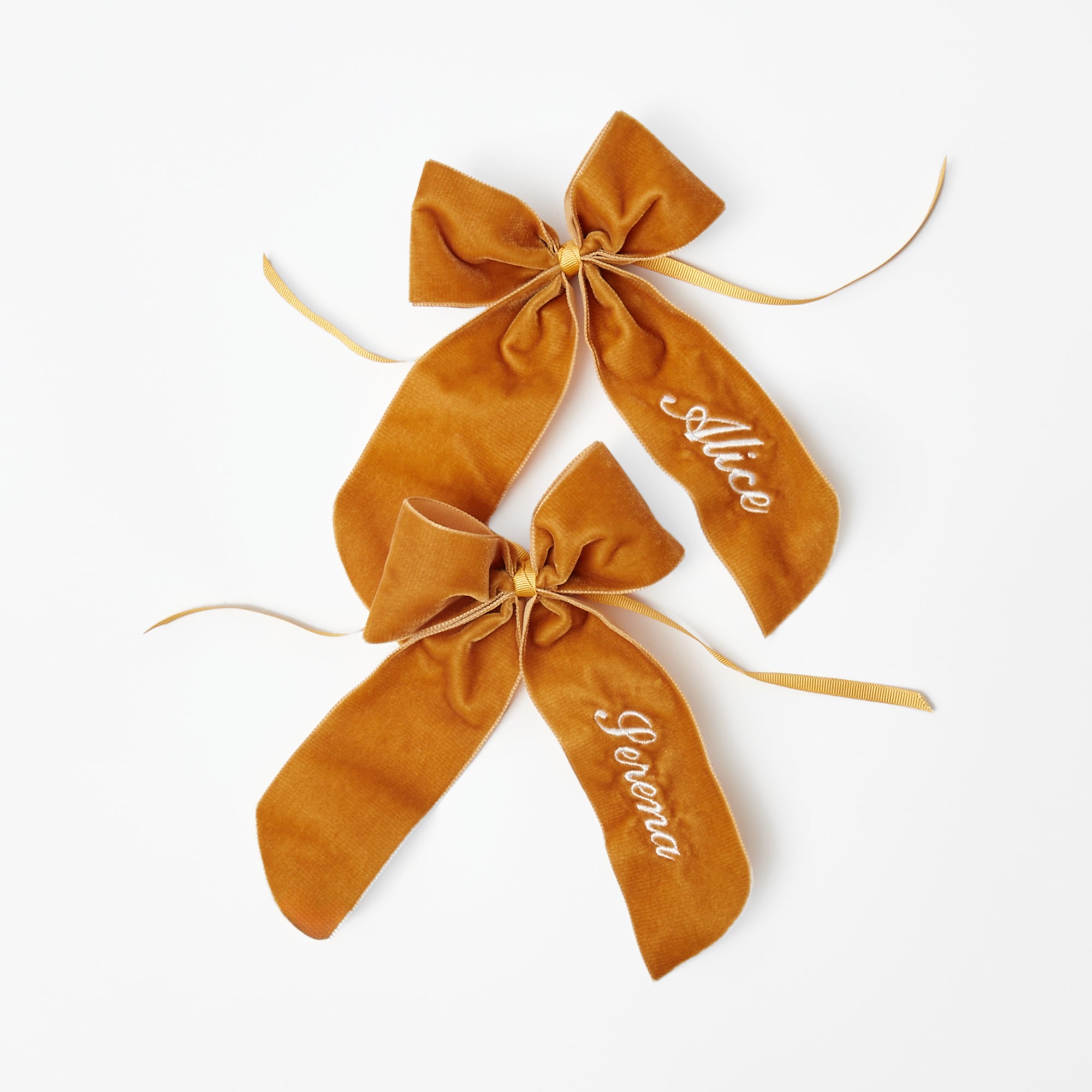 Customizable bow featuring a rich mustard color.