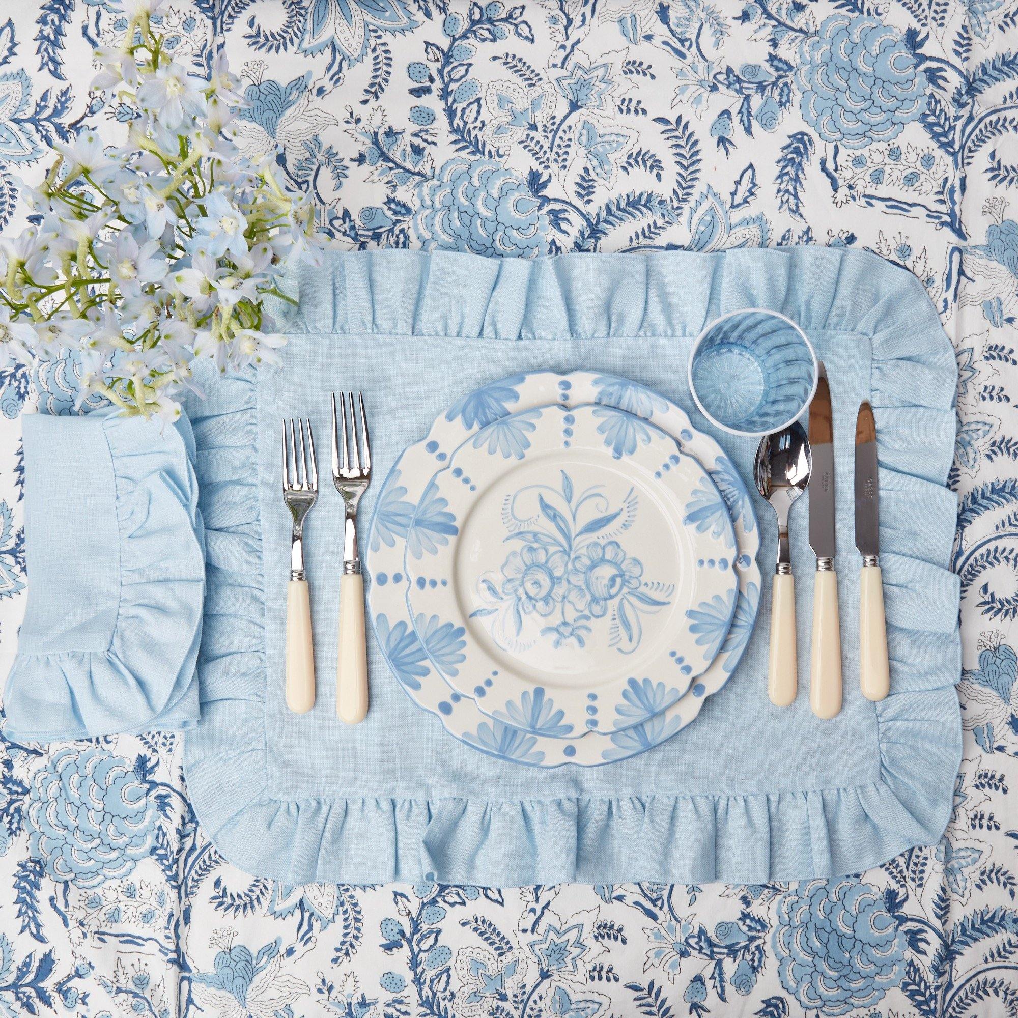 https://www.mrsalice.com/cdn/shop/files/sky-blue-ruffle-linen-placemats-set-of-4-mrs-alice-4_07411da6-e022-4c95-99f4-95f576b34fef.jpg?v=1689277713