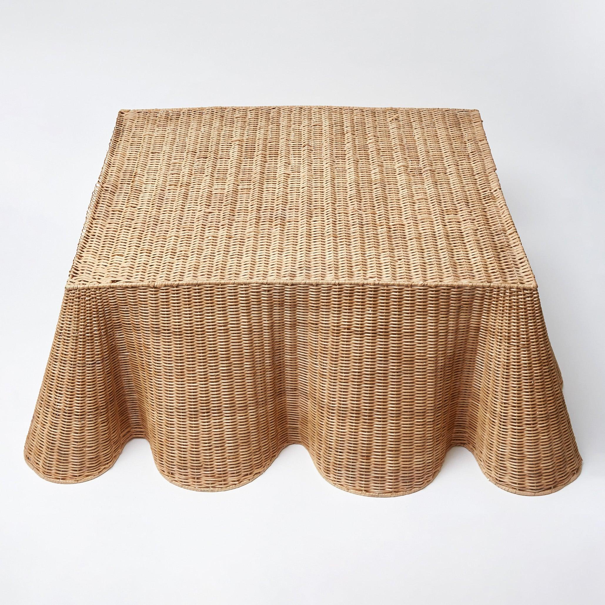 Elevate your interior with the captivating Vivienne Rattan Scalloped Ottoman, designed to bring a touch of sophistication and warmth to your living area while providing a comfortable seat.