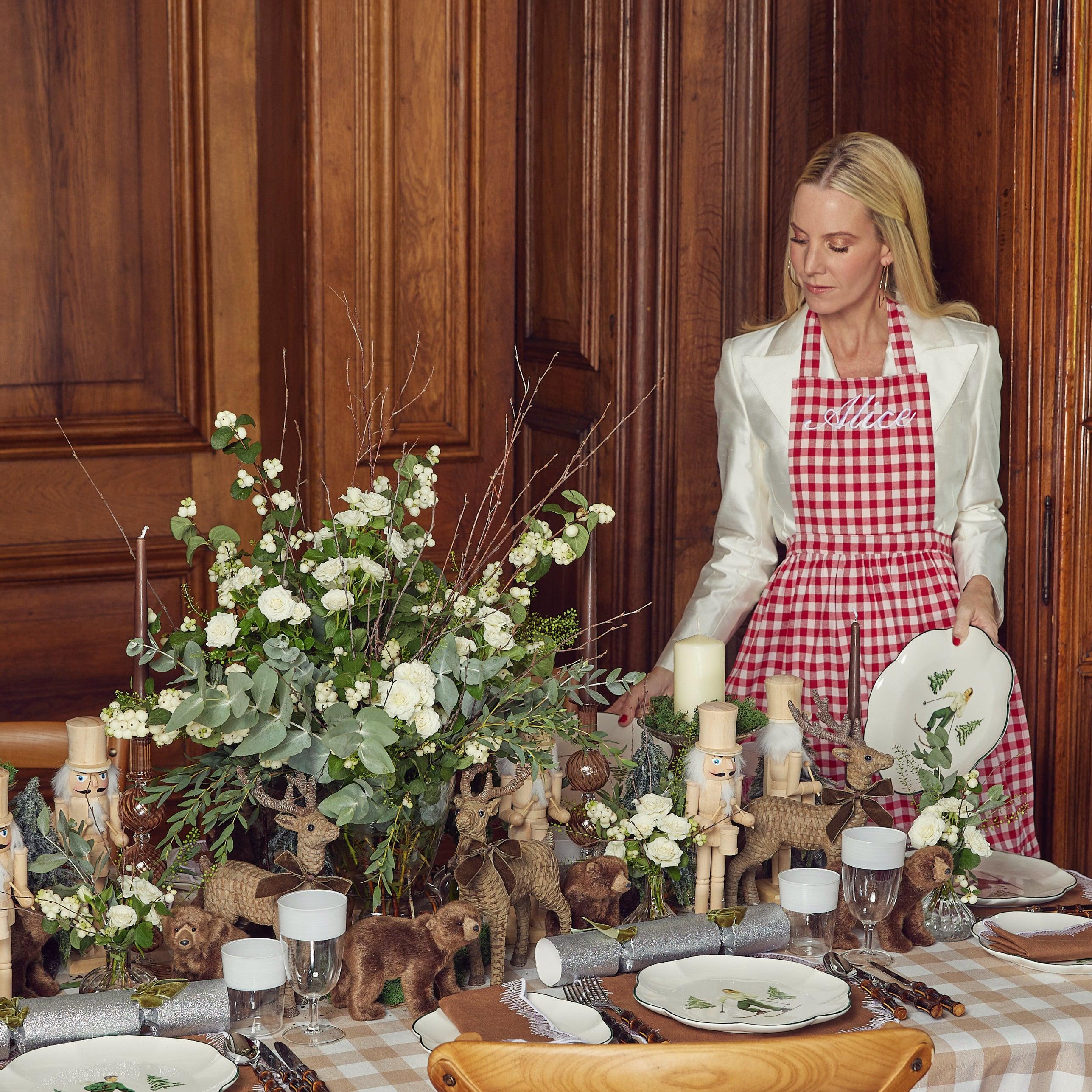 Enhance your cooking routine with the playful and delightful Swiss Red Frilled Gingham Apron, designed to bring a touch of tradition and whimsy to your culinary endeavors.